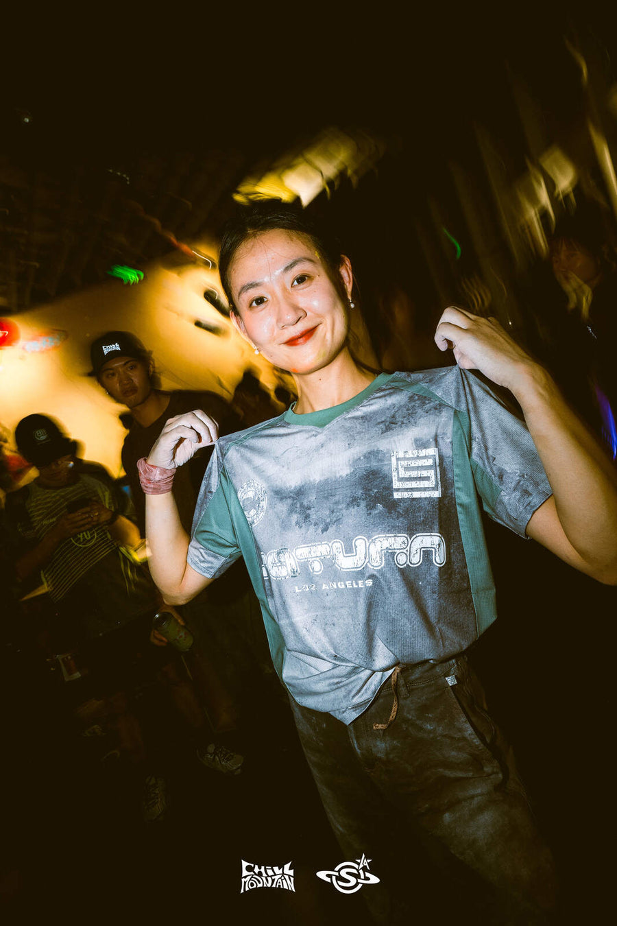 Holding up the Saturn collab jersey