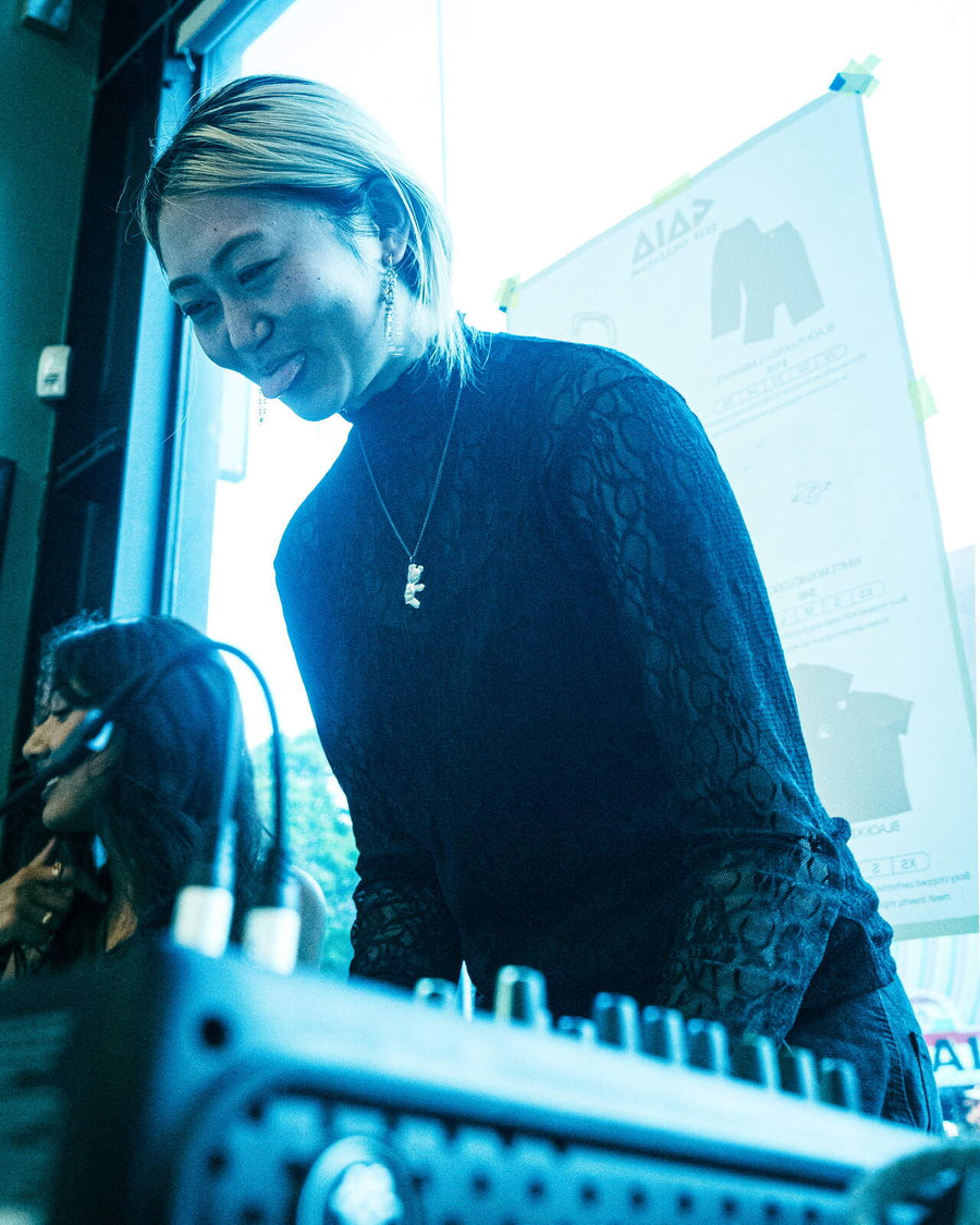 DJ smiling at the decks during the Boiler Room